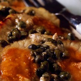 Filetto di maiale ai capperi con pomodorini